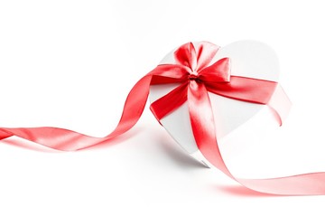 Valentines day gift box with red ribbon isolated on white background. Concept of Valentines, anniversary, mothers day and birthday greeting, copyspace, topview.