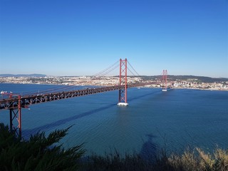 Lisbon suspension bridge under a blue sky