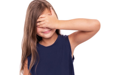 Little girl closed her eyes with her hand. Isolated on white.