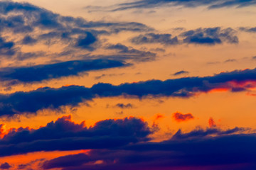orange sunset sky with clouds. beautiful nature background