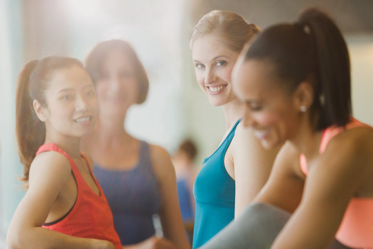 Smiling Women Talking In Sunny Gym Studio