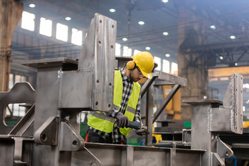 Steel worker working in fabrication factory