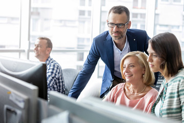 Business people working at computer in office