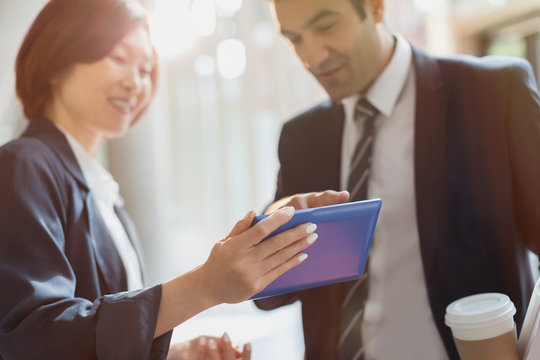 Business people using digital tablet