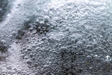 Obraz premium Boiling foam in a saucepan on an electric stove