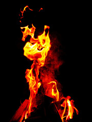 Fire flames against black background. Abstract nature wallpaper.