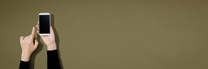 Person using a white smartphone with copyspace