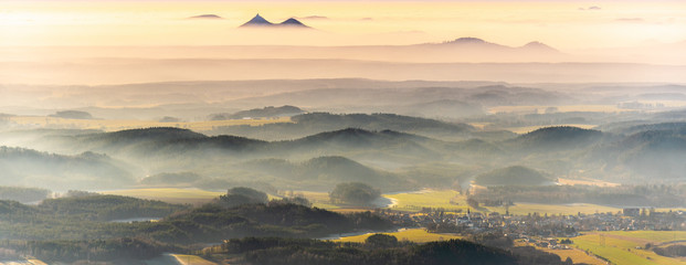 Bezdez twin mountains rising from the mist. Weather temperature inversion, Czech Republic