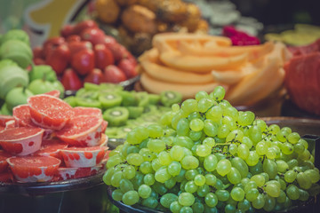 Freshly cut delicious juicy fruits for sale