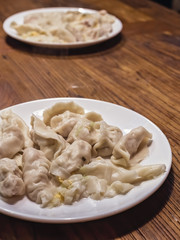 Plates full of freshly cooked chinese dumplings