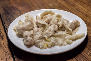 Plate full of freshly cooked chinese dumplings
