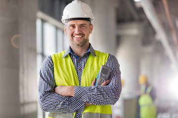 Portrait smiling engineer at construction site