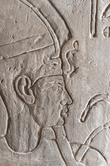 Close up of a generic ancient Egyptian carving of a man's face.