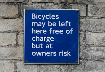 Blue and white warning sign about bike theft prevention.