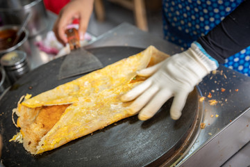 Folding savory egg pancakes in China