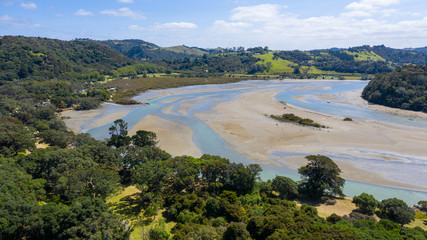 Aerial View from the Beach, Ocean, Green Trees of Wenderholm Regional Park in New Zealand - Auckland Area