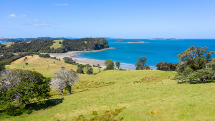 Aerial View from the Beach, Ocean, Mountain, Green Trees of Wenderholm Regional Park in New Zealand - Auckland Area