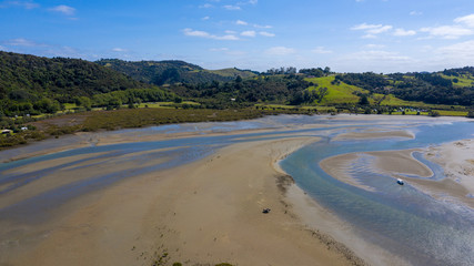 Aerial View from the Beach, Ocean, Green Trees of Wenderholm Regional Park in New Zealand - Auckland Area