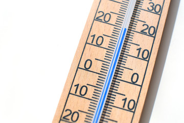 Close up of a wooden wall thermometer