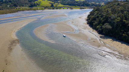 Aerial View from the Beach, Ocean, Green Trees of Wenderholm Regional Park in New Zealand - Auckland Area