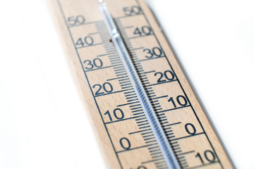 Close up of a wooden wall thermometer