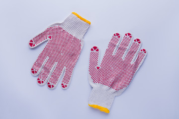 White protective gloves with red circles. Isolated on white background.