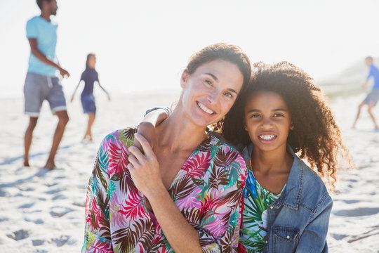 Portrait smiling, affectionate mother daughter on sunny summer beach