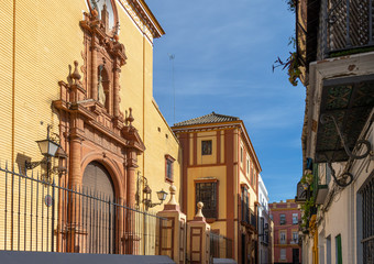 Fototapeta na wymiar Fachada de la Parroquia de San Bernardo de Sevilla, en el barrio típico de San Bernardo, a mediodía de un día soleado