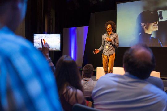 Male Speaker On Stage Talking To Audience