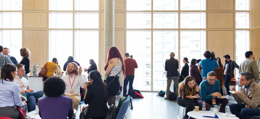 Business people networking, talking at conference