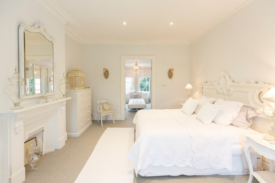 White, luxury home showcase interior bedroom