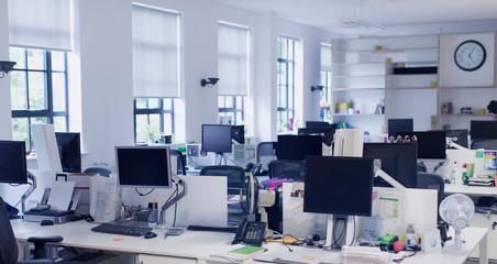 Computers on desks in open plan office
