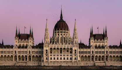 Fototapeta premium Close-up on the he Hungarian Parliament building in symmetry after sunset with beautiful sky.