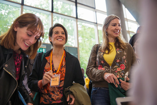 Smiling businesswoman at conference