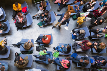 Overhead view speaker and audience at conference