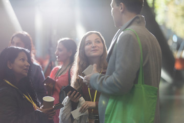 Business people talking at conference