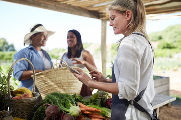 Woman working at farmer‚Äôs market