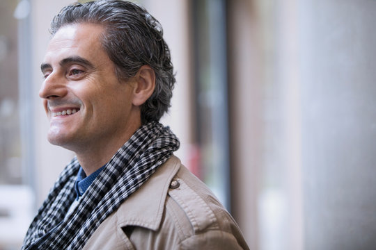 Smiling businessman in scarf