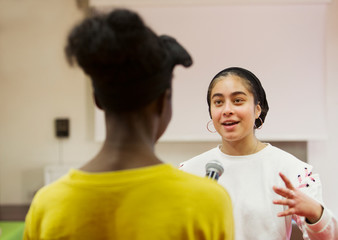 Teenage girl being interviewed for vlog