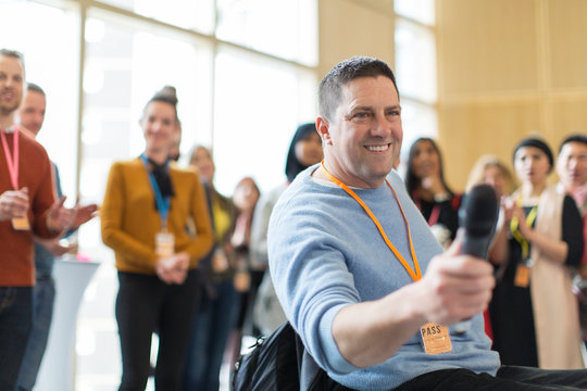 Smiling male speaker answering audience questions