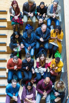 Overhead view clapping conference audience
