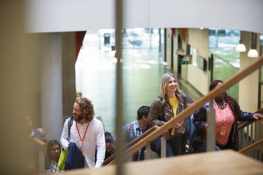 Business people ascending stairs