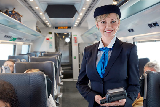 Portrait confident female attendant on passenger train