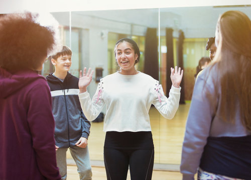 Smiling, confident teenage girl in dance class studio
