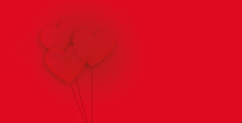 Valentines motive with moving red balloons on red background with copy space.