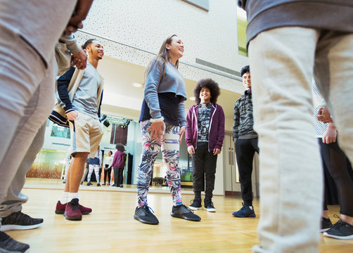 Teenagers talking in dance class studio