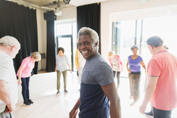 Portrait smiling, confident senior man exercising in circle