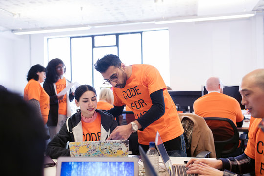 Hackers coding for charity at hackathon
