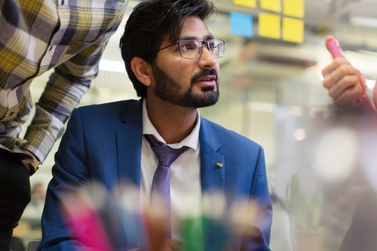 Focused, attentive businessman listening in meeting