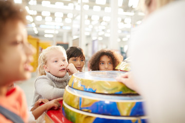 Curious kids at interactive earth exhibit in science center